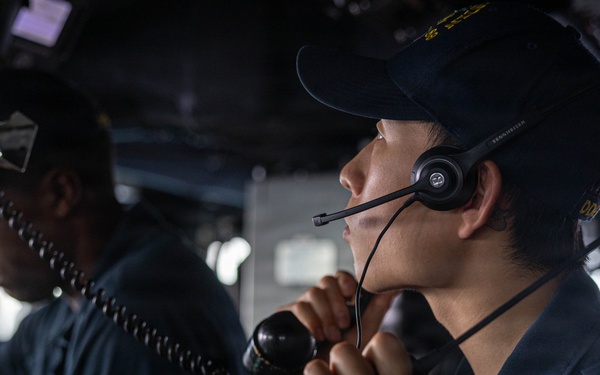 USS Mustin conducts a replenishment-at-sea with USNS Carl Brashear