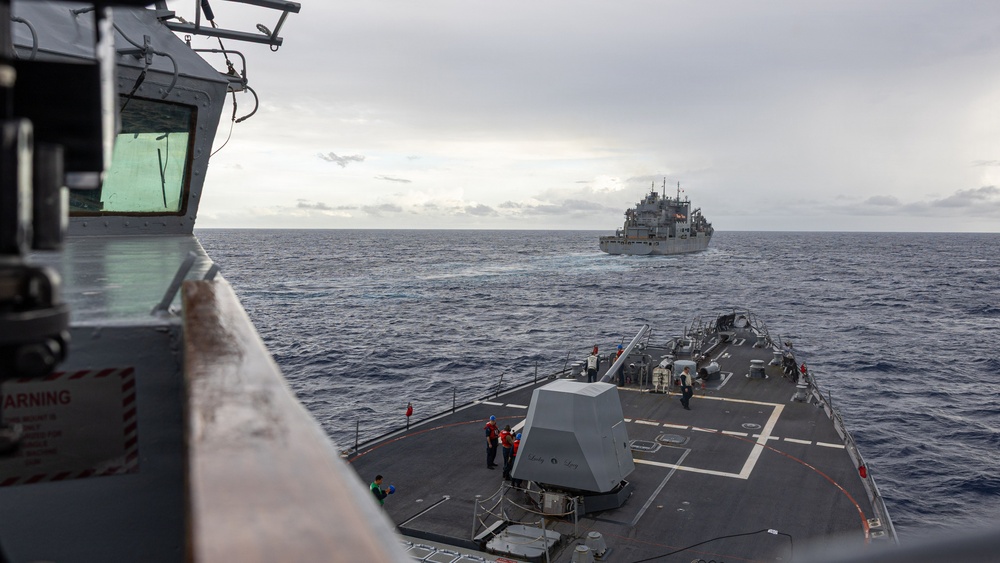 USS Mustin conducts a replenishment-at-sea with USNS Carl Brashear