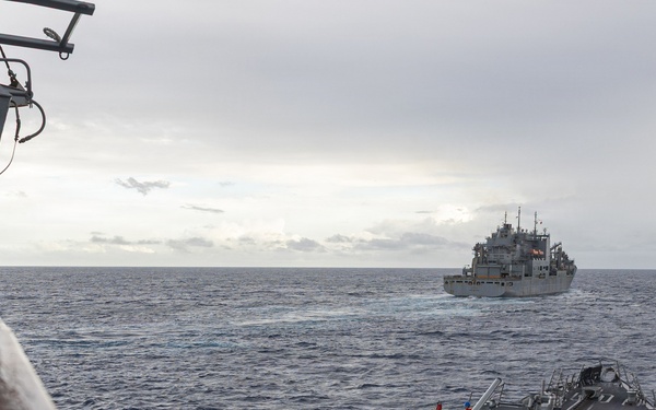 USS Mustin conducts a replenishment-at-sea with USNS Carl Brashear