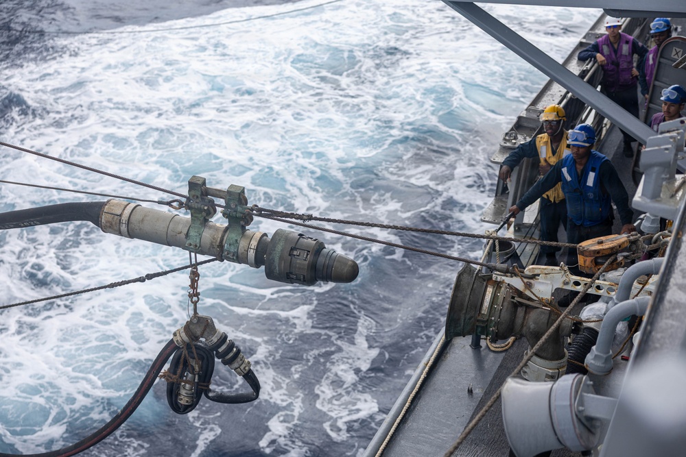 USS Mustin conducts a replenishment-at-sea with USNS Carl Brashear