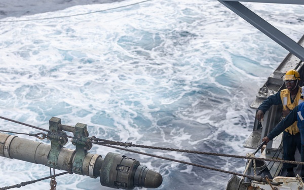 USS Mustin conducts a replenishment-at-sea with USNS Carl Brashear