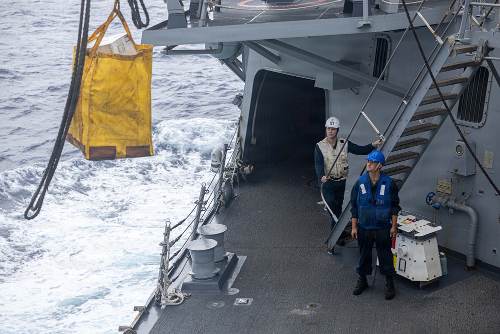 USS Mustin conducts a replenishment-at-sea with USNS Carl Brashear