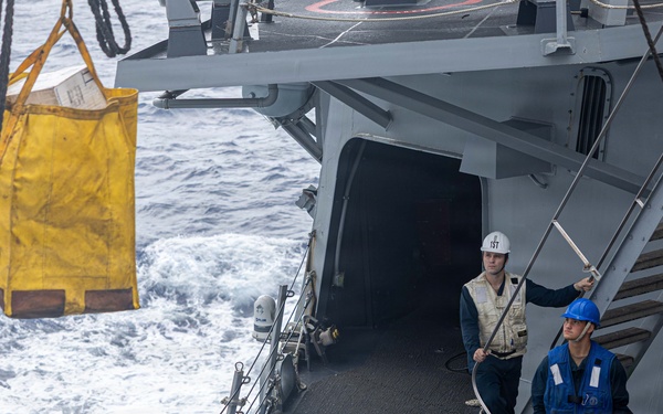 USS Mustin conducts a replenishment-at-sea with USNS Carl Brashear