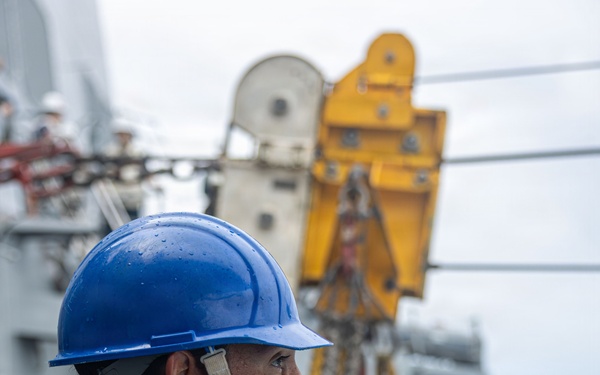 USS Mustin conducts a replenishment-at-sea with USNS Carl Brashear