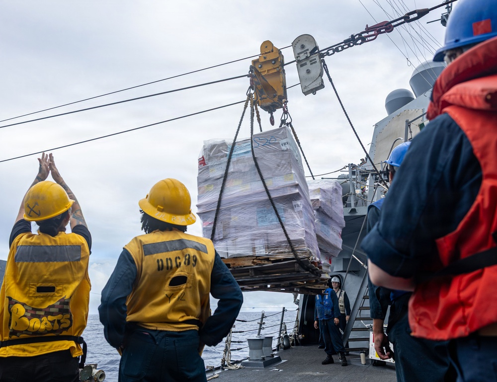 USS Mustin conducts a replenishment-at-sea with USNS Carl Brashear