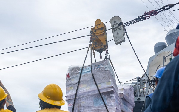 USS Mustin conducts a replenishment-at-sea with USNS Carl Brashear