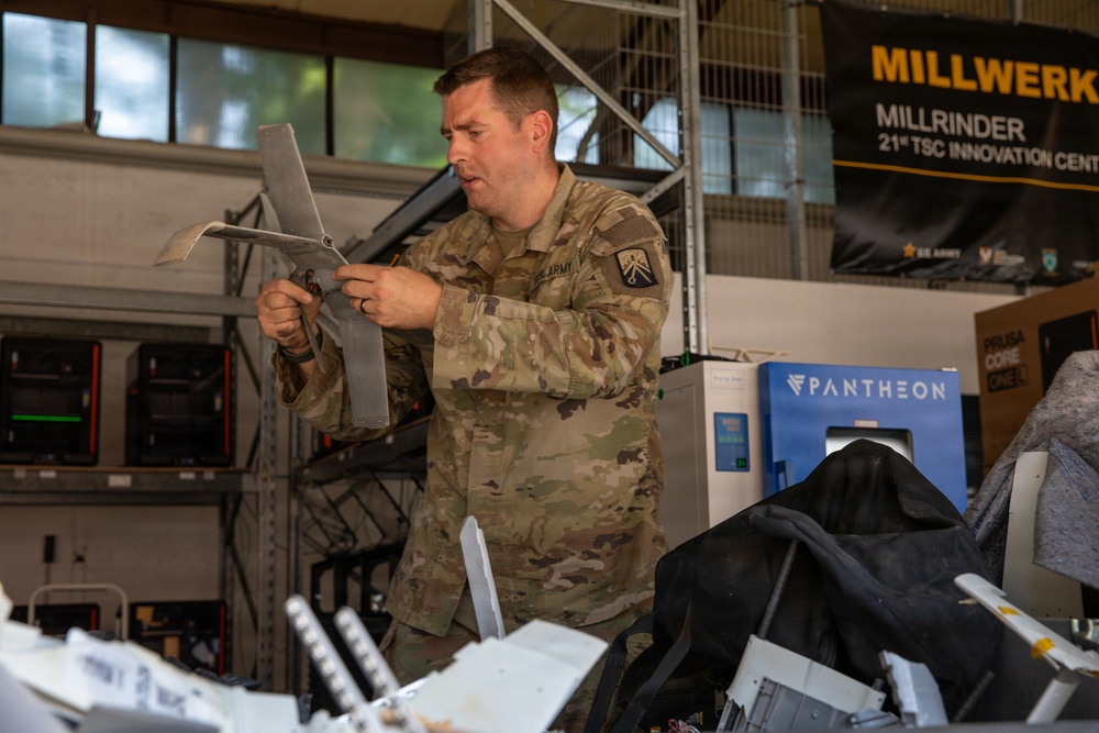 21st Theater Sustainment Command Soldier Evaluates Salvaged Drone Components