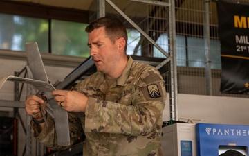 21st Theater Sustainment Command Soldier Evaluates Salvaged Drone Components