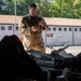 21st Theater Sustainment Command Soldier Evaluates Salvaged Drone Components