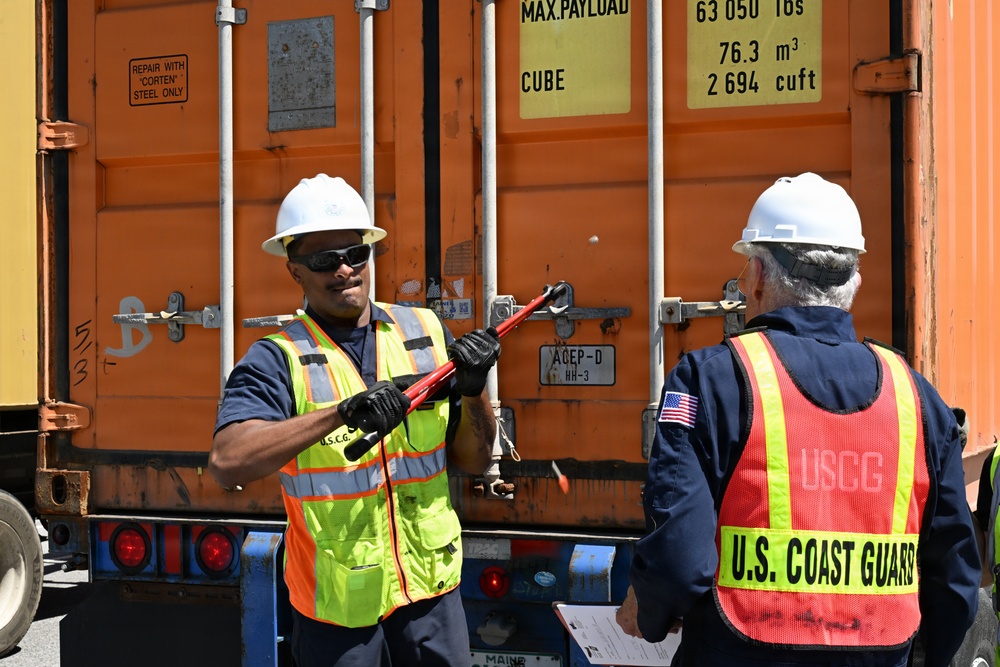 Marine science technicians open connex boxes