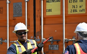 Marine science technicians open connex boxes