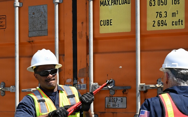 Marine science technicians open connex boxes
