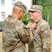 Col. Maxwell presents award to Col. Vermillion
