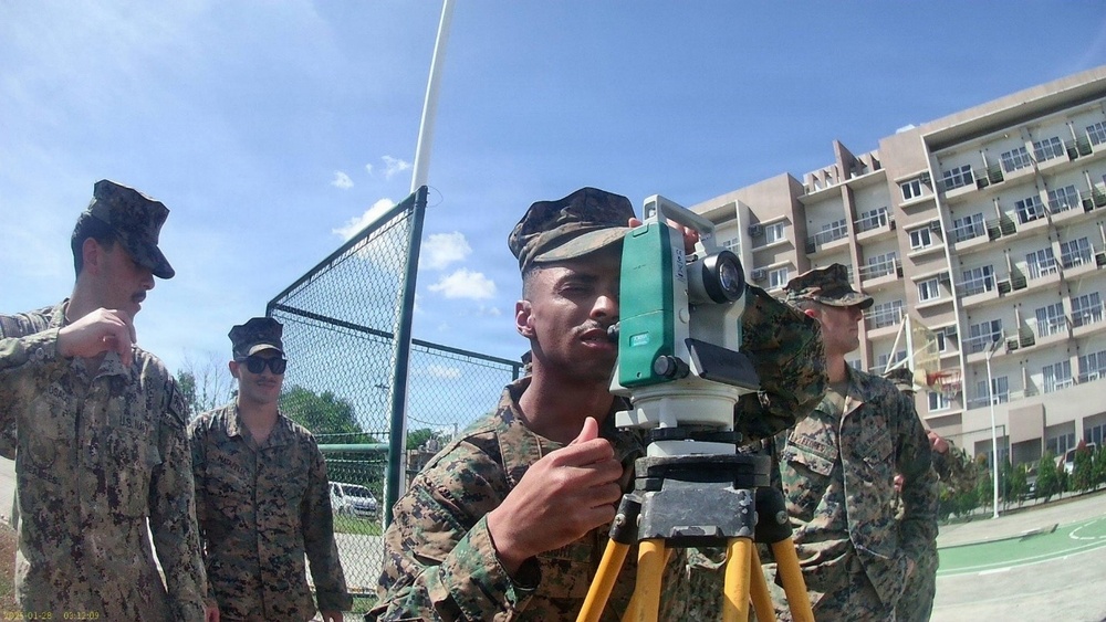 U.S. Marines and Sailors conduct joint ground survey training while deployed to the Philippines