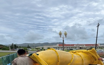U.S. Marines assigned to MCED-P replace a playground for locals while deployed to Guam