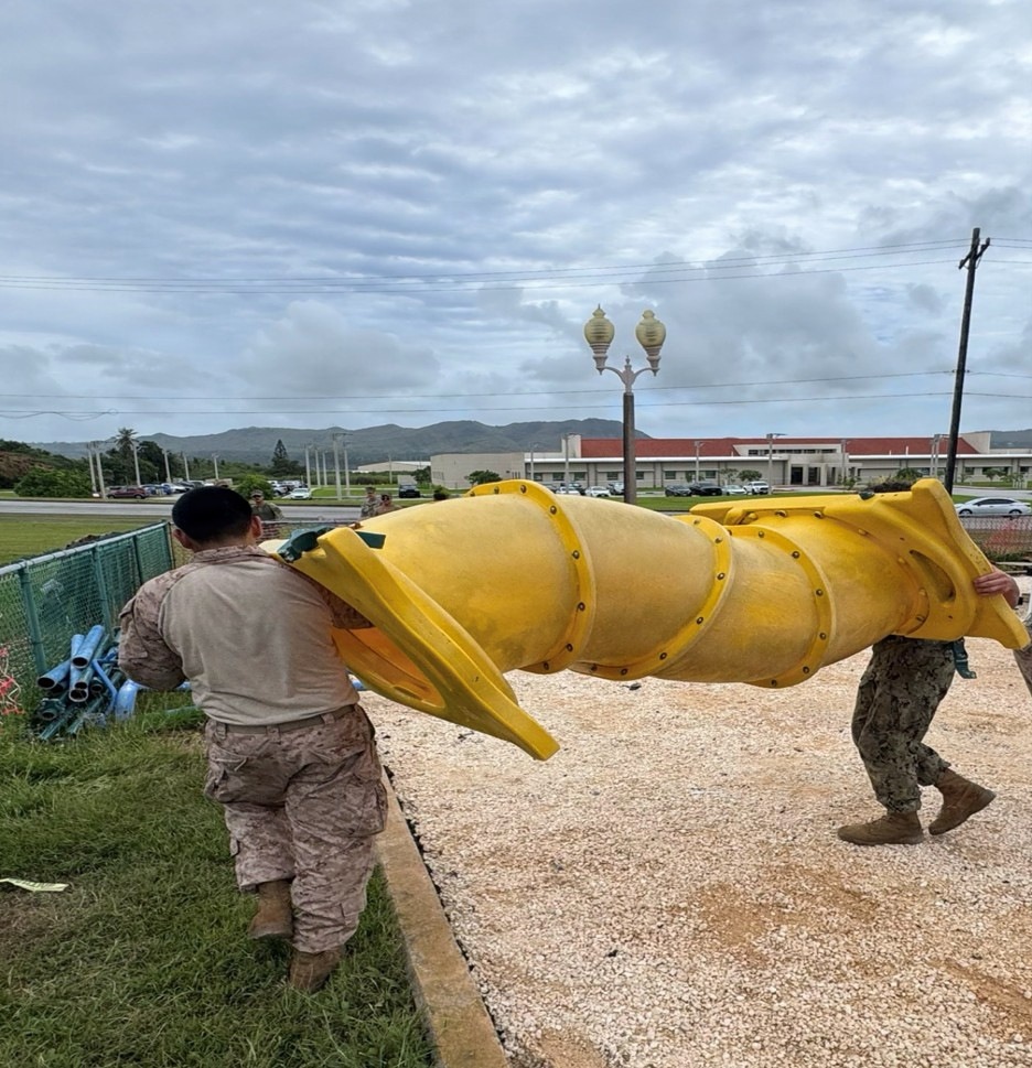 U.S. Marines assigned to MCED-P replace a playground for locals while deployed to Guam