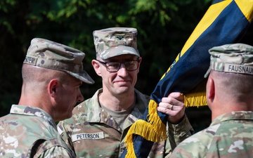 Col. Fausnaugh passes guidon to Col. Peterson at 19th BCD Change of Command