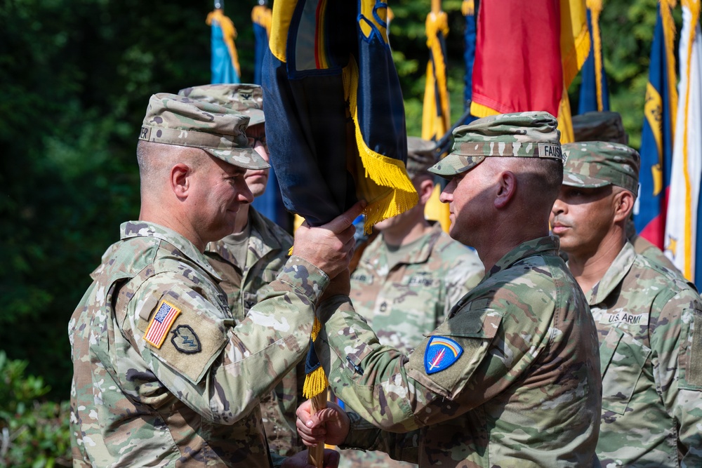 Col. Fausnaugh passes guidon to Col. Peterson at 19th BCD Change of Command