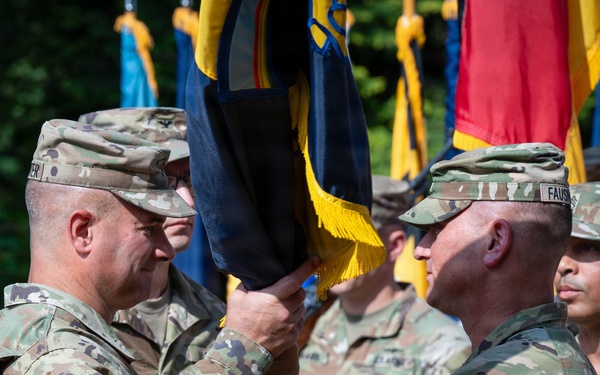 Col. Fausnaugh passes guidon to Col. Peterson at 19th BCD Change of Command