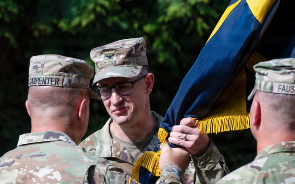 Col. Fausnaugh passes guidon to Col. Peterson at 19th BCD Change of Command