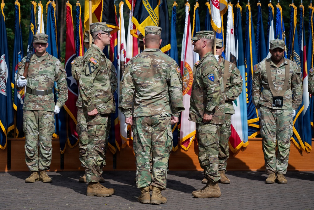 Col. Fausnaugh passes guidon to Col. Peterson at 19th BCD Change of Command
