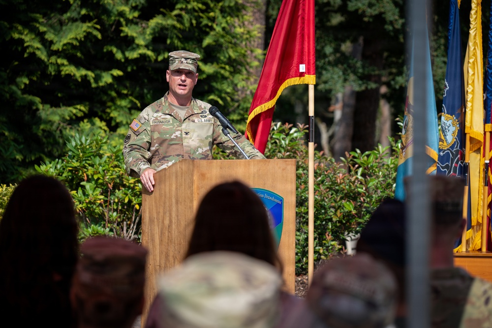 Col. Fausnaugh passes guidon to Col. Peterson at 19th BCD Change of Command