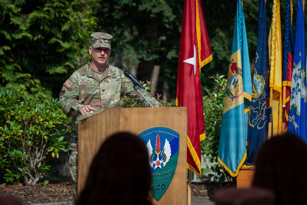 Col. Fausnaugh passes guidon to Col. Peterson at 19th BCD Change of Command