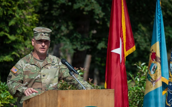 Col. Fausnaugh passes guidon to Col. Peterson at 19th BCD Change of Command