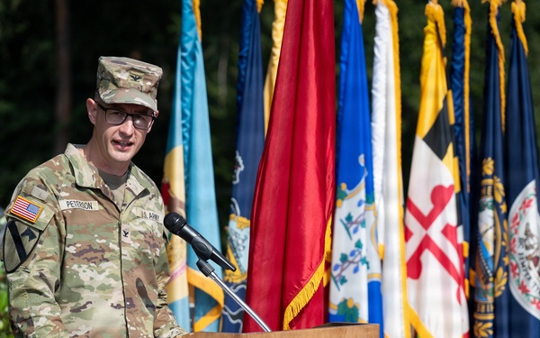 Col. Fausnaugh passes guidon to Col. Peterson at 19th BCD Change of Command