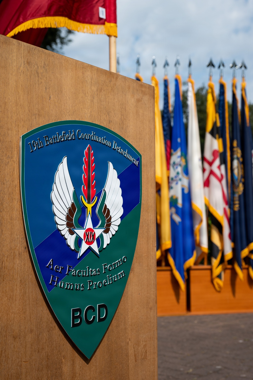 Col. Fausnaugh passes guidon to Col. Peterson at 19th BCD Change of Command