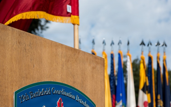 Col. Fausnaugh passes guidon to Col. Peterson at 19th BCD Change of Command