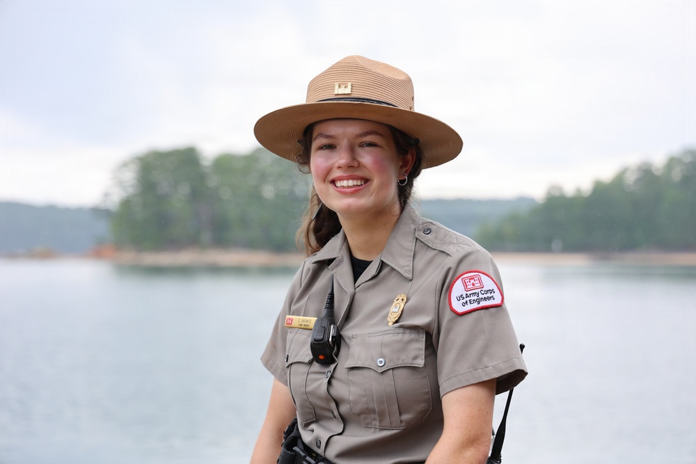 U.S. Army Corps of Engineers park ranger poses at waterfront recreation area