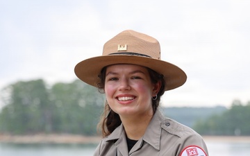 U.S. Army Corps of Engineers park ranger poses at waterfront recreation area