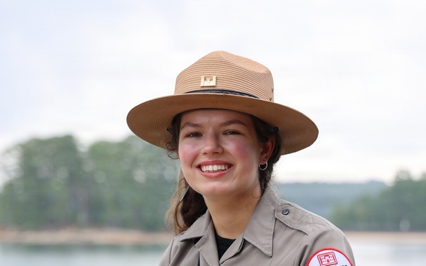U.S. Army Corps of Engineers park ranger poses at waterfront recreation area