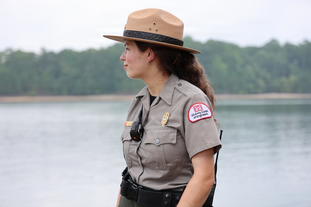 U.S. Army Corps of Engineers ranger stands watch near waterway