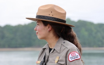 U.S. Army Corps of Engineers ranger stands watch near waterway
