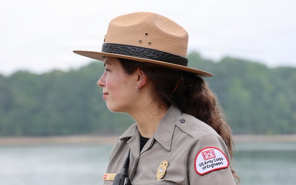 U.S. Army Corps of Engineers ranger stands watch near waterway