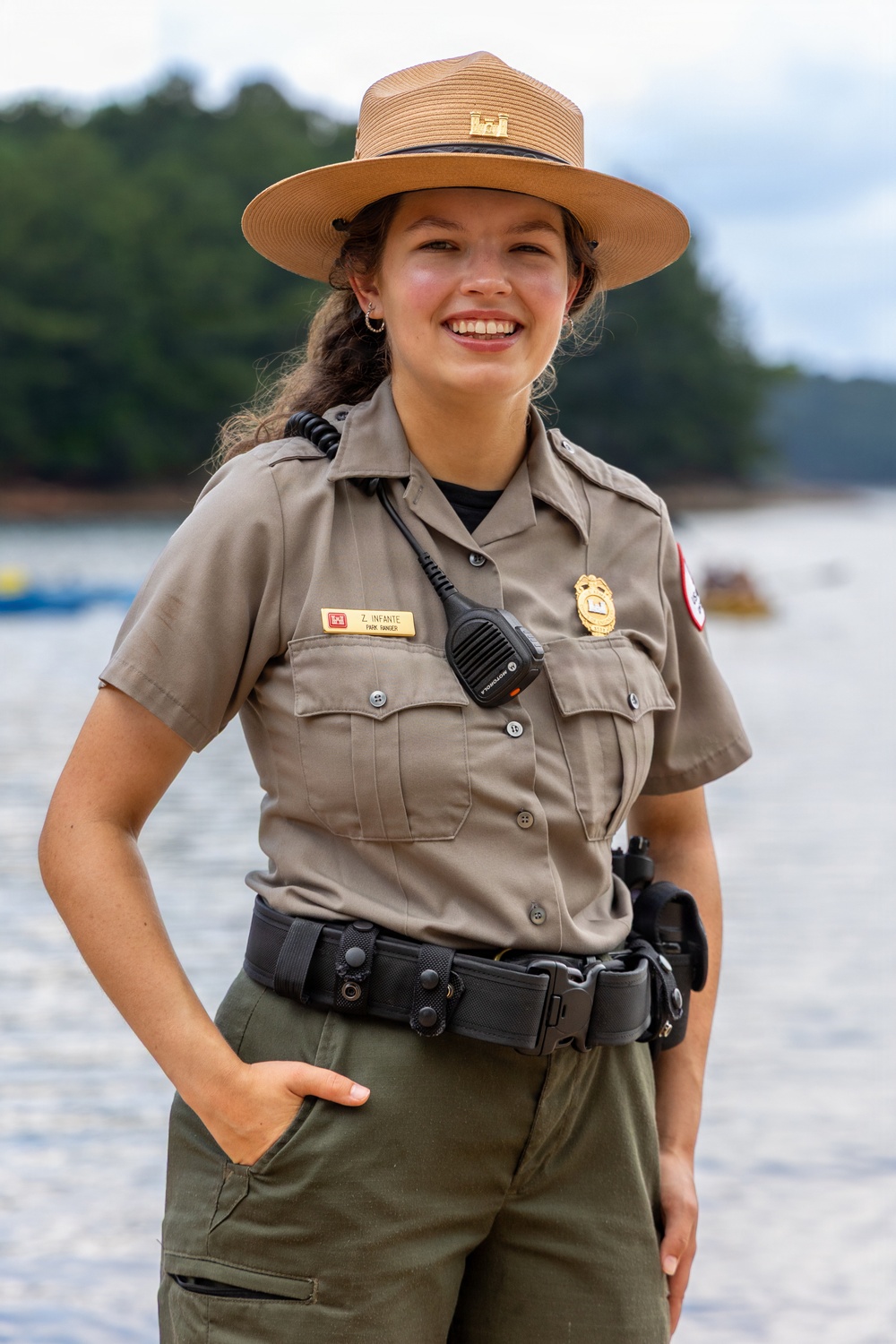 U.S. Army Corps of Engineers park ranger poses at waterfront recreation area