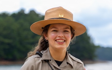 U.S. Army Corps of Engineers park ranger poses at waterfront recreation area