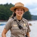 U.S. Army Corps of Engineers park ranger poses at waterfront recreation area