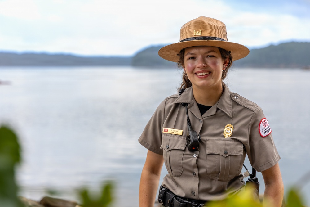 U.S. Army Corps of Engineers Park Ranger poses at lakeside recreation area