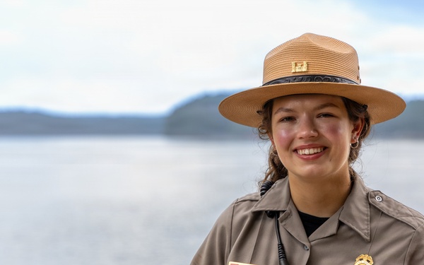 U.S. Army Corps of Engineers Park Ranger poses at lakeside recreation area