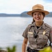 U.S. Army Corps of Engineers Park Ranger poses at lakeside recreation area
