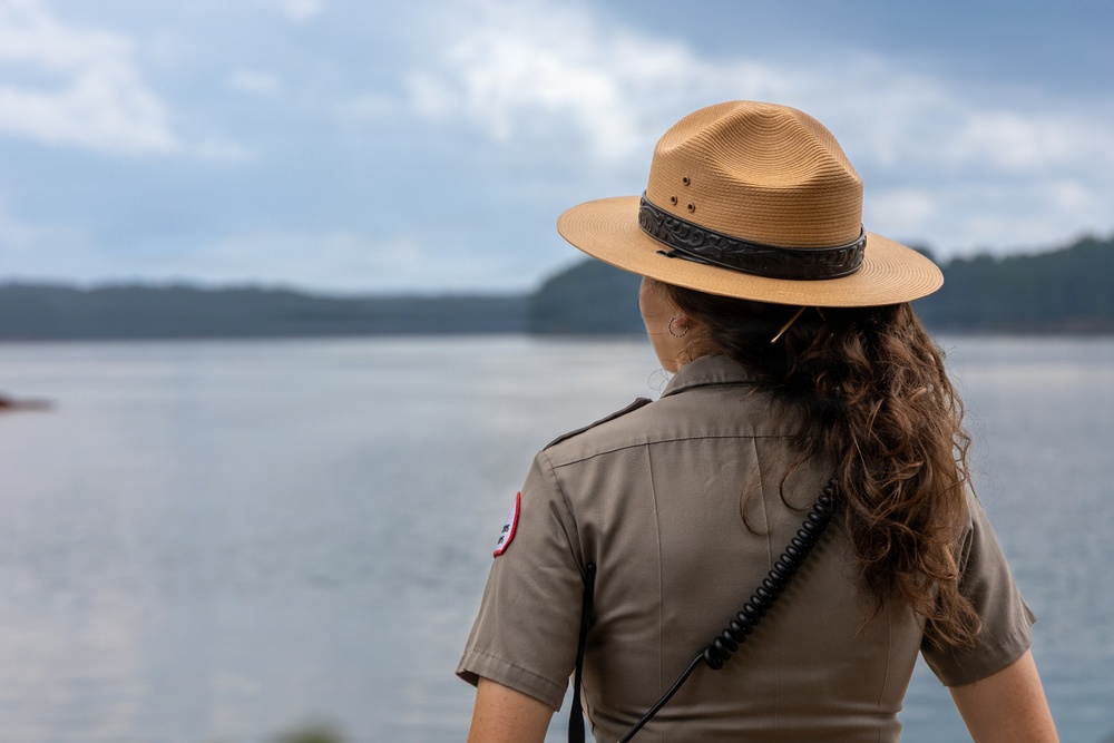Park Ranger Surveys Waterway from Overlook