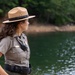 U.S. Army Corps of Engineers park ranger surveys lake shoreline during patrol operations