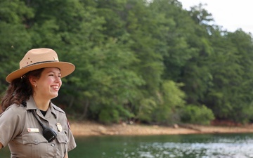 U.S. Army Corps of Engineers park ranger monitors recreational activity at lakeside recreation area