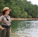 U.S. Army Corps of Engineers park ranger monitors recreational activity at lakeside recreation area