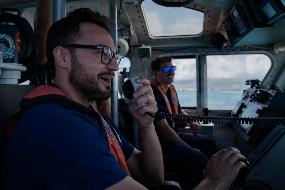 Partner nations participate in a buoy restoration project during RIMPAC 26