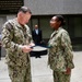 Rear Adm. T.J. Zerr presents IS2 Amaya Yuille with the Junior Sailor of the Year Award