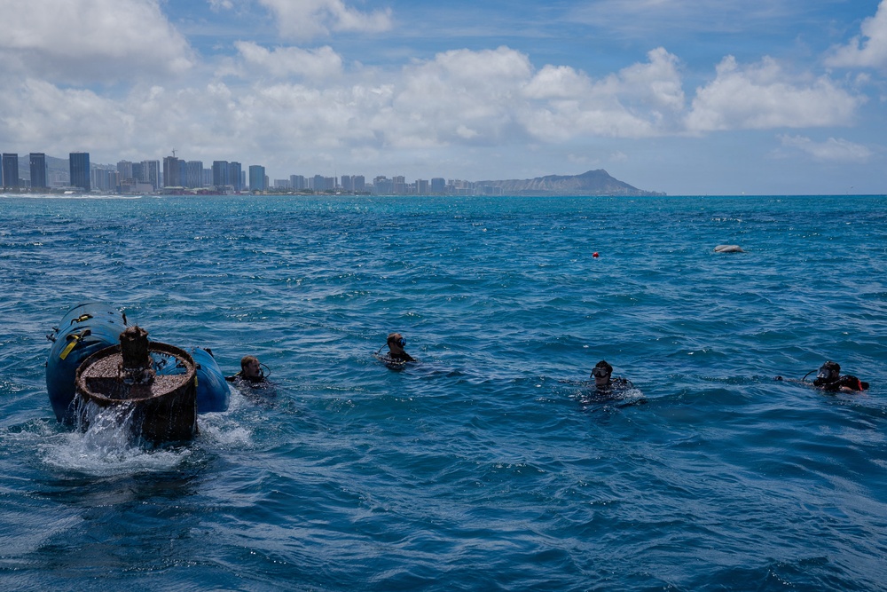 Partner nations participate in a buoy restoration project during RIMPAC 26